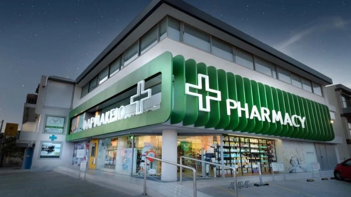 Pharmacy storefront in Malaysia at dusk - fast-track drug registration